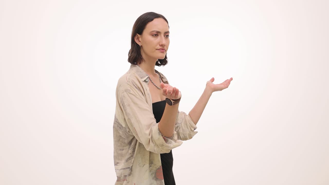 A woman in fashion clothing posing for the camera