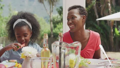 happy family eating together at table