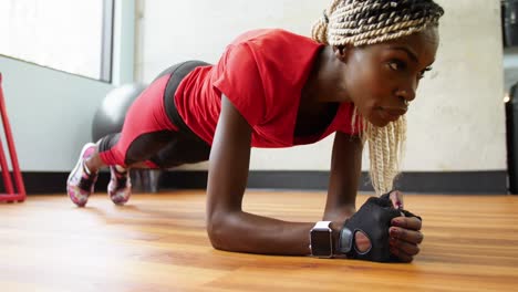 fit woman exercising in gym