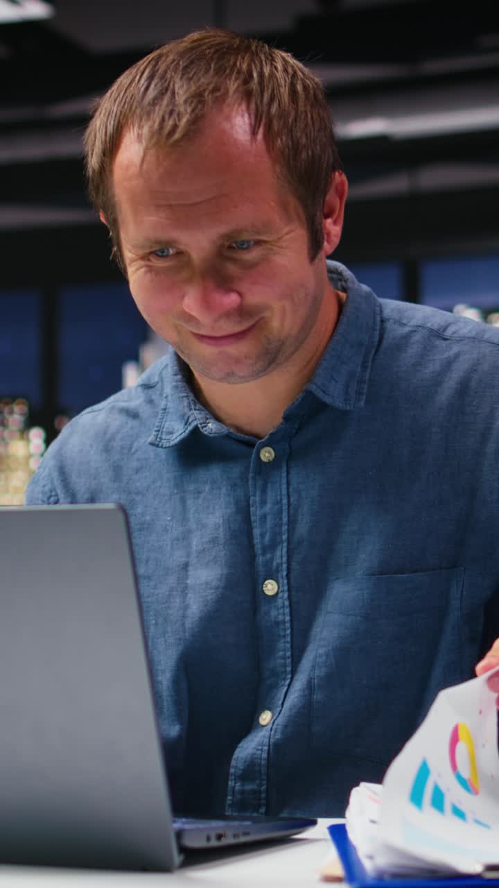Vertical Video Startup employee consulting on a new corporate project with charts