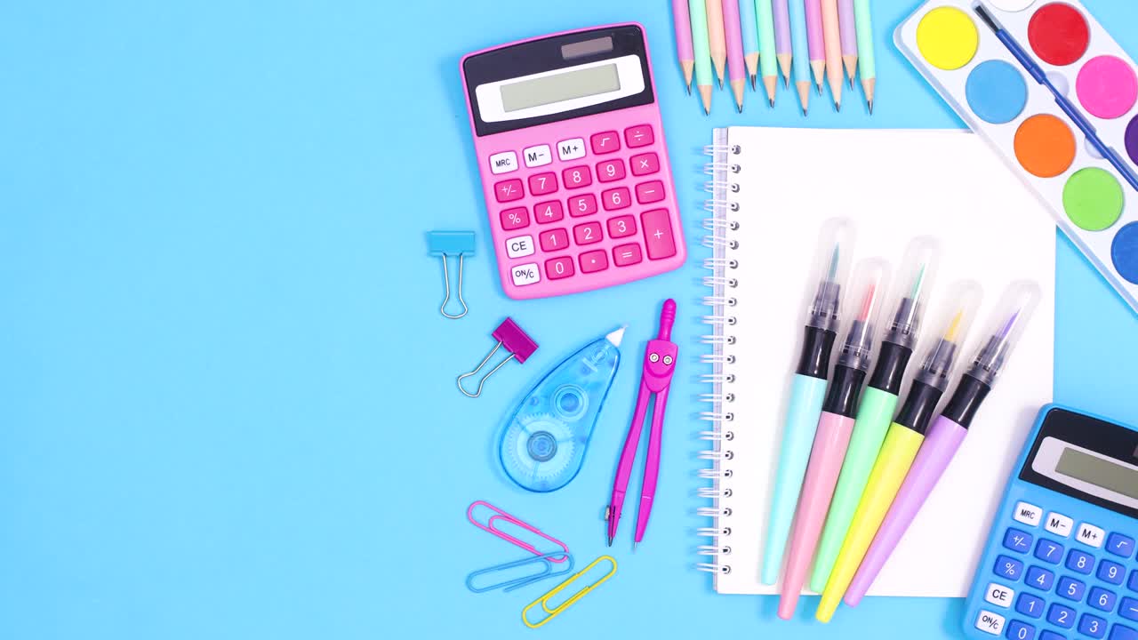 School accessories and notebook move on right side of pastel blue theme with copy space. Stop motion