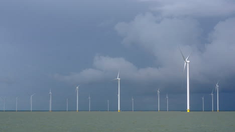 near shore wind farm under a gloomy sky