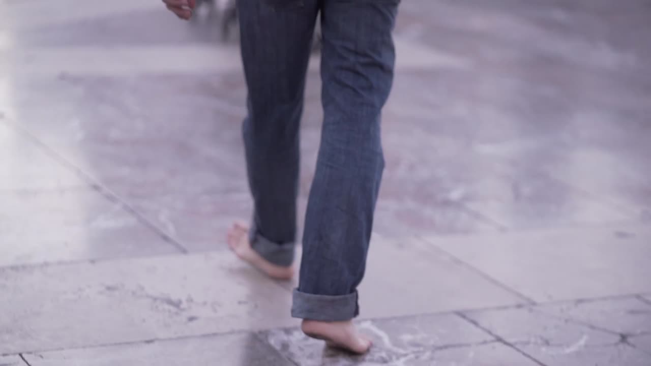 Barefoot Person Walking on Stone Tile Floor