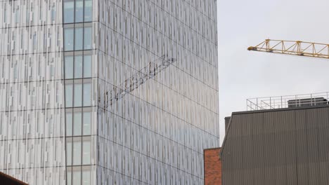 modern facade of a building in gamlestaden urban district of gothenburg, sweden. aerial close-up shot