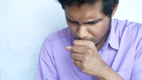 man coughing