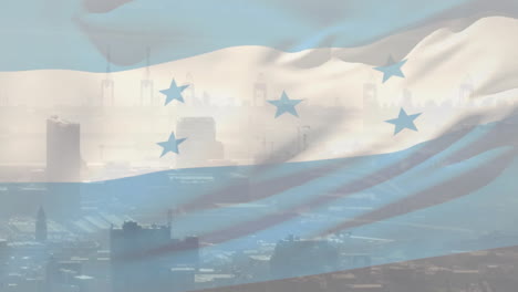 honduran flag waving with city skyline and industrial cranes in background