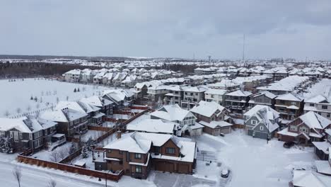 Aerial-view-of-a-suburban-community-in-Calgary,-Alberta-in-winter