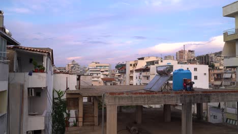 day time view of many high rise, half finished construction buildings in city