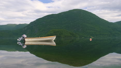 Boat-With-Outboard-Motor-Floating-On-Hornindalsvatn-Lake-In-Norway-With-Perfect-Reflection-Of-Lush-Green-Mountain-On-Water-Surface