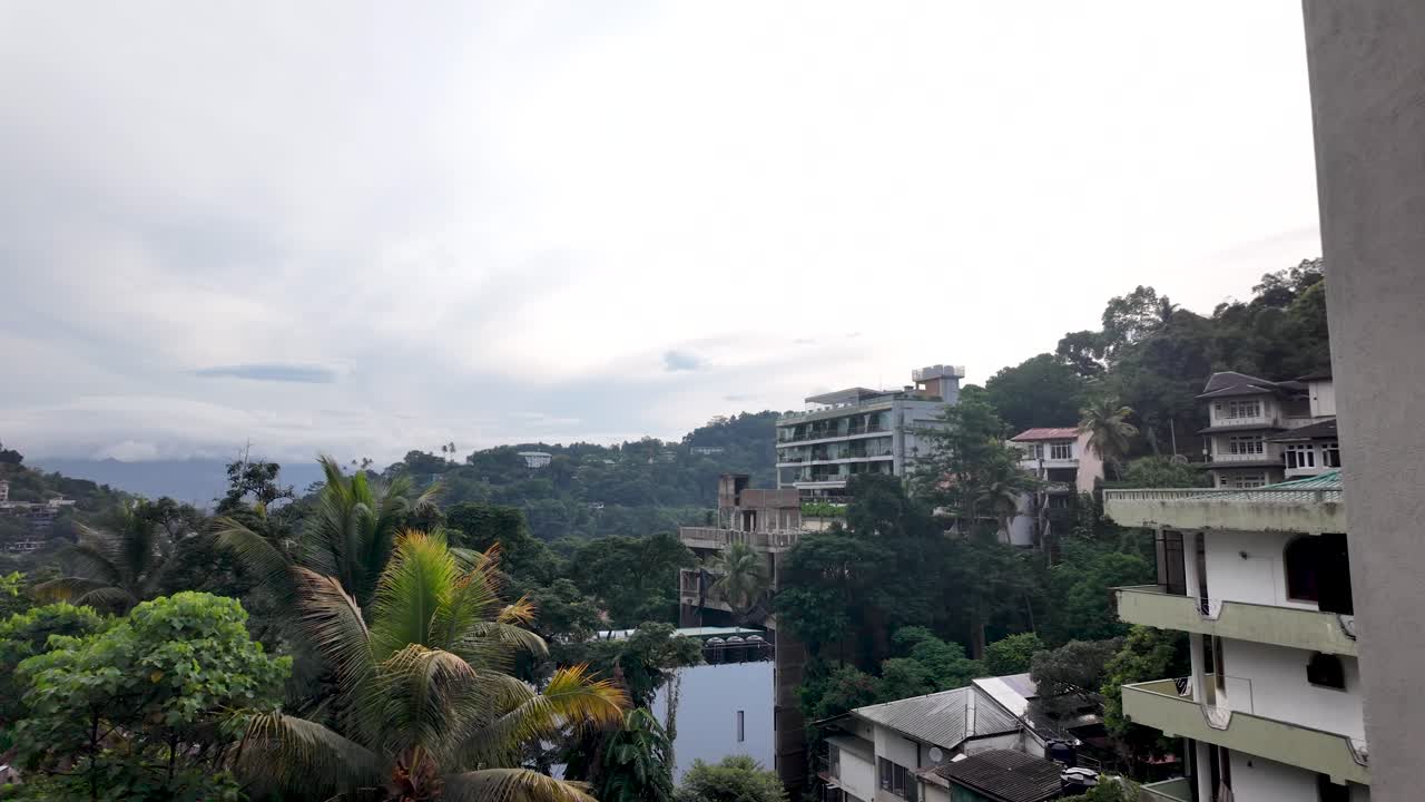 Cloudy Mountain View of a Tropical City