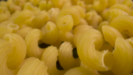 Close-up-over-a-pile-of-corkscrew-pasta