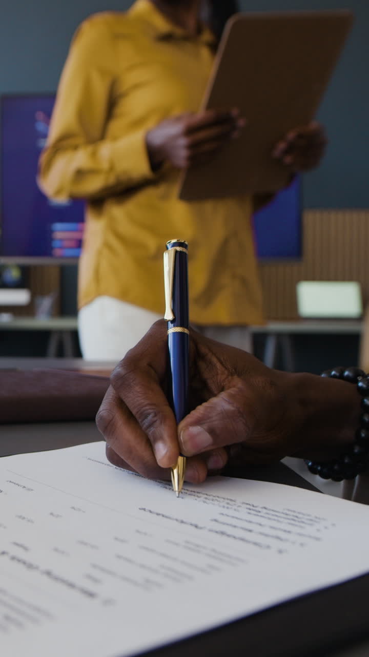 Signing a Contract in a Business Meeting