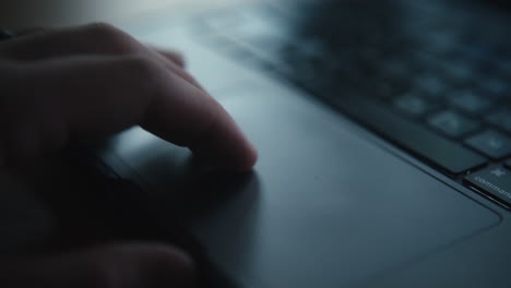 finger on laptop touchpad