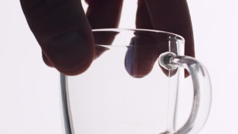 abstract shot of a waiter putting down a small espresso glass