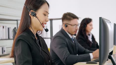 business people wearing headset working in office