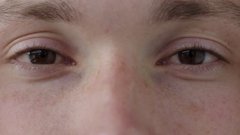 close up young man eyes looking at camera caucasian male healthy eyesight