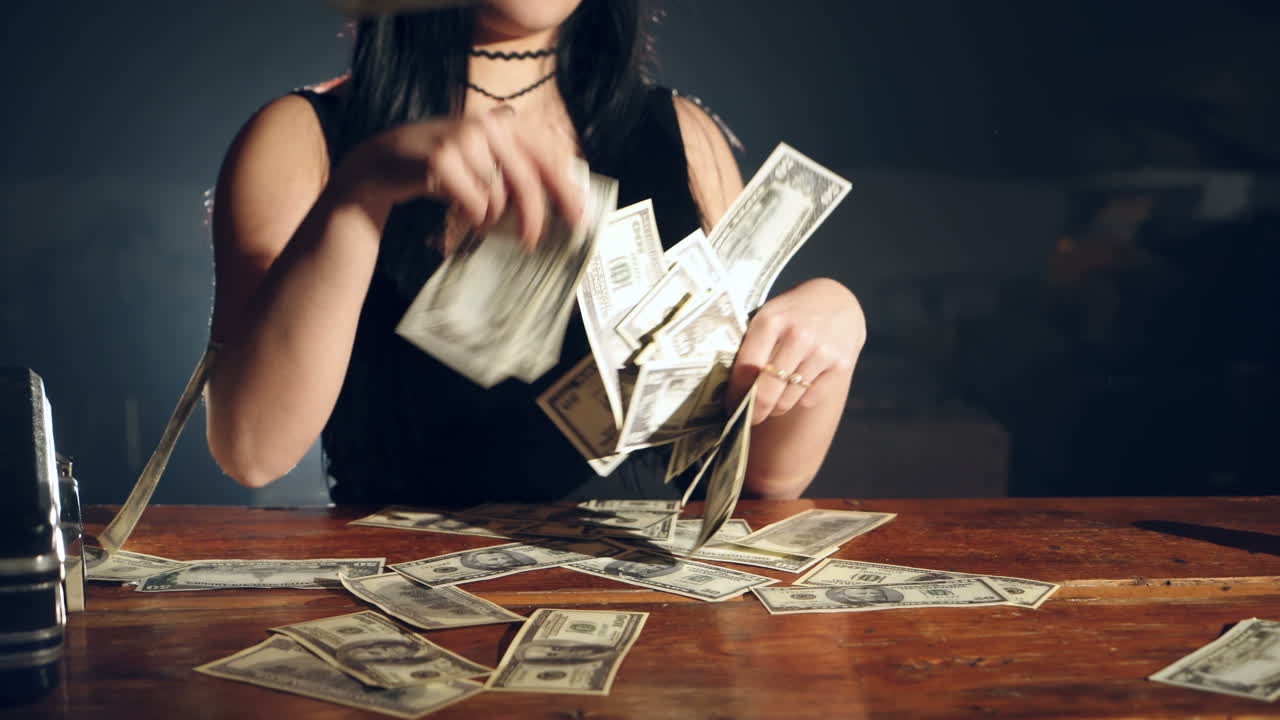 Arrested beautiful woman in police. Illegal money and handcuffs.