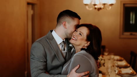 a mother and son's loving embrace at a wedding