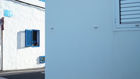 whitewashed houses with blue accents