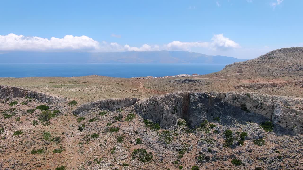 Aerial view of the mountain cliff and Tropical beach with deep blue sea and skyscape view