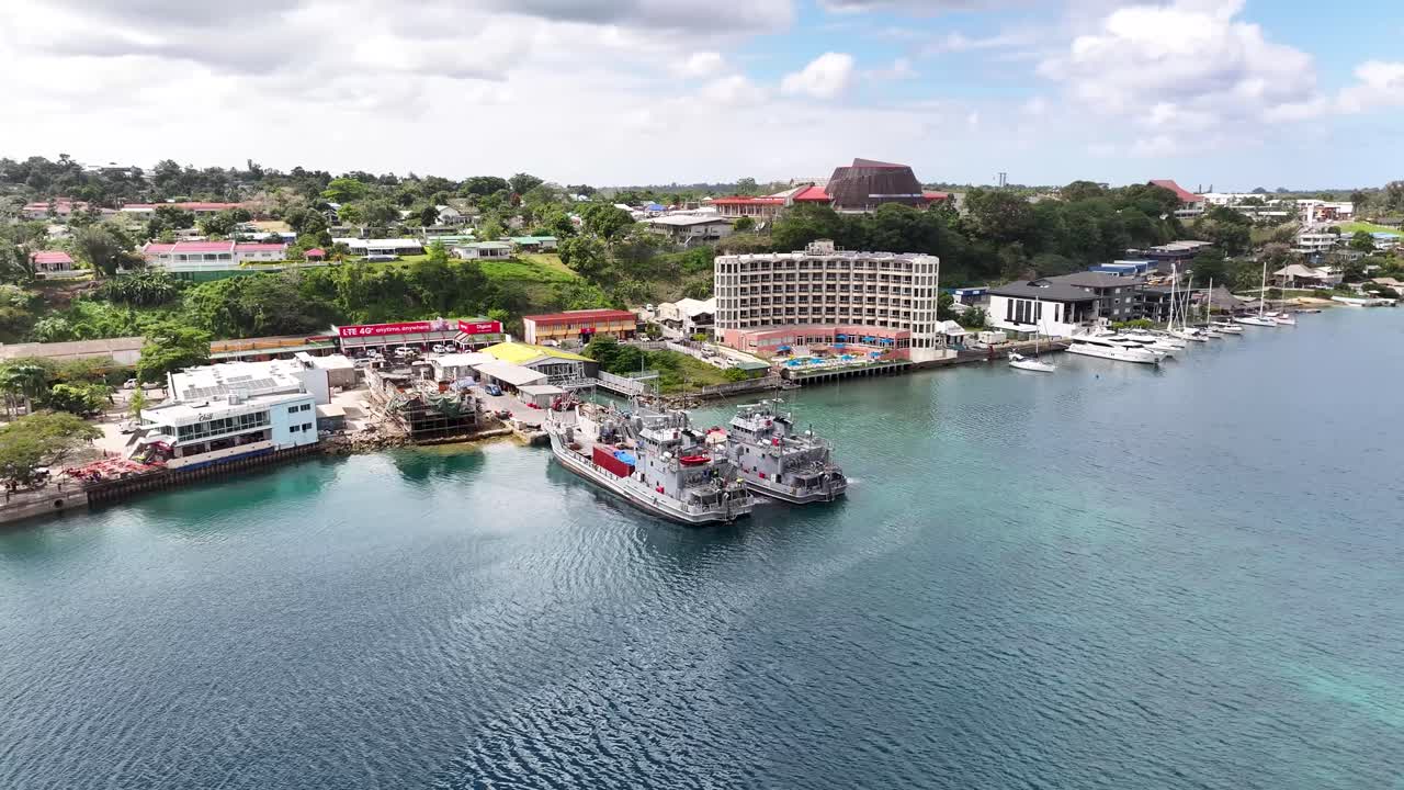 Aerial View of a Coastal Town with Boats and Ships in Harbor