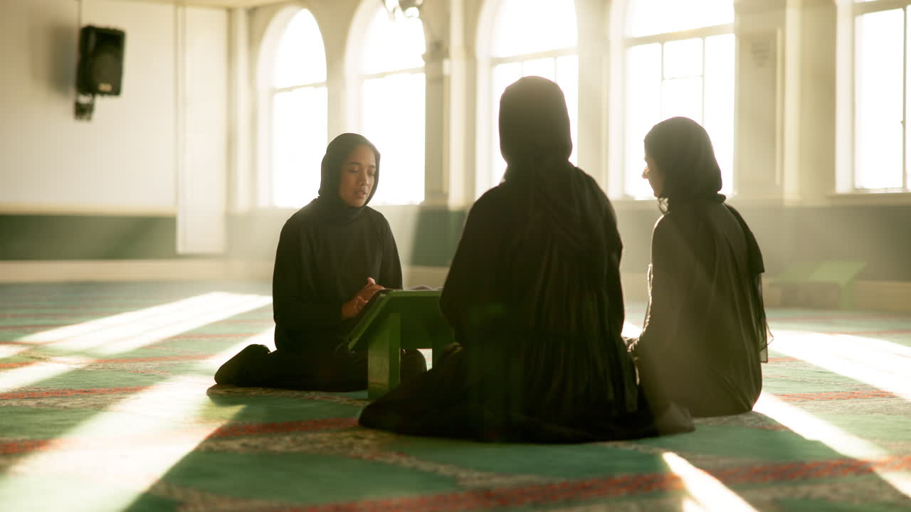 Muslim women praying in a mosque