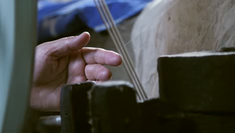 hand guiding silk fibres