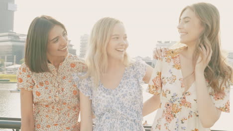 three women enjoying a conversation outside