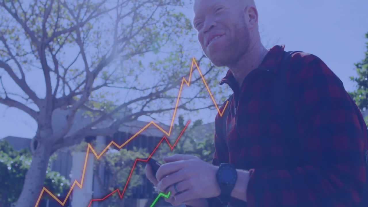 Animation of financial data processing over albino african american businessman with smartphone