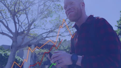 animation of financial data processing over albino african american businessman with smartphone