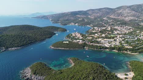 syvota coastal village with green islands, beaches and holiday resorts at epirus, greece - aerial