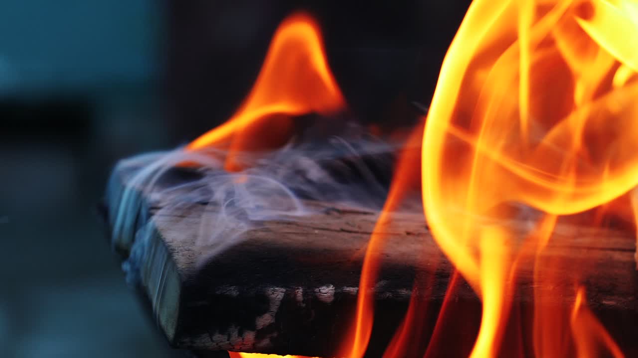 Slow motion burning fire in a home fireplace. Close-up
