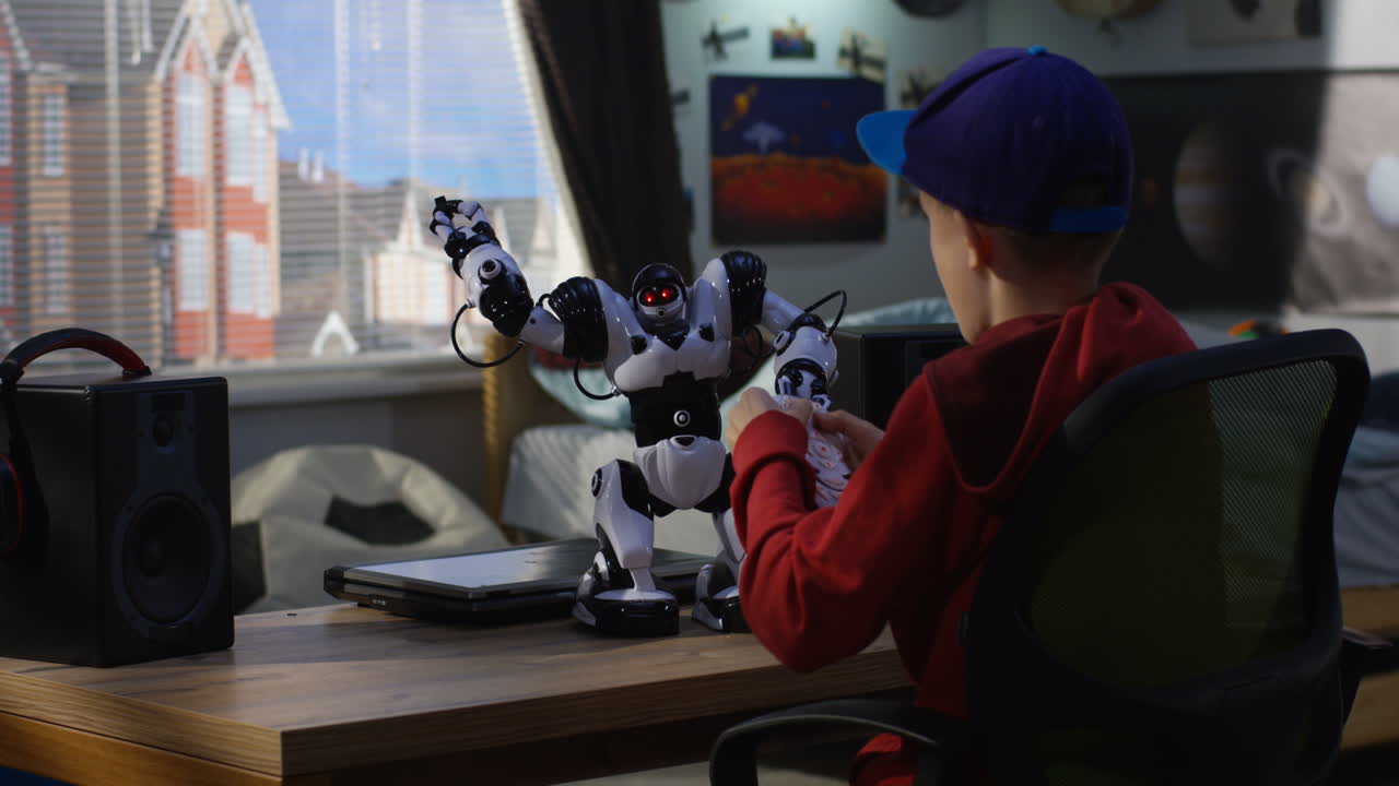 Boy playing with robot toy in his bedroom
