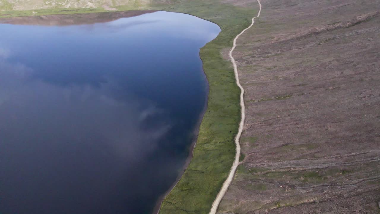 Aerial View of Lake and Road