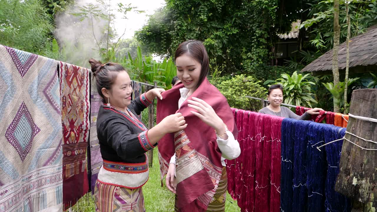Thai Women Displaying Traditional Textiles
