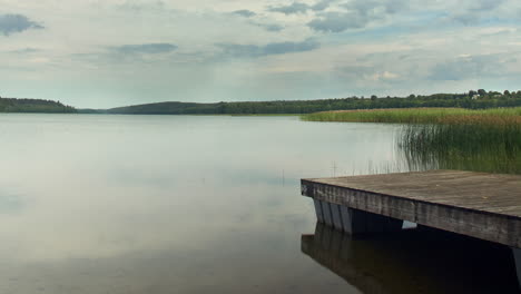 Footbridge.-Lake.-Cloudy-sky.-Time-lapse