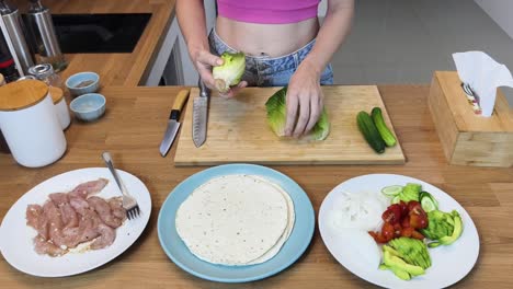 woman preparing a healthy wrap meal