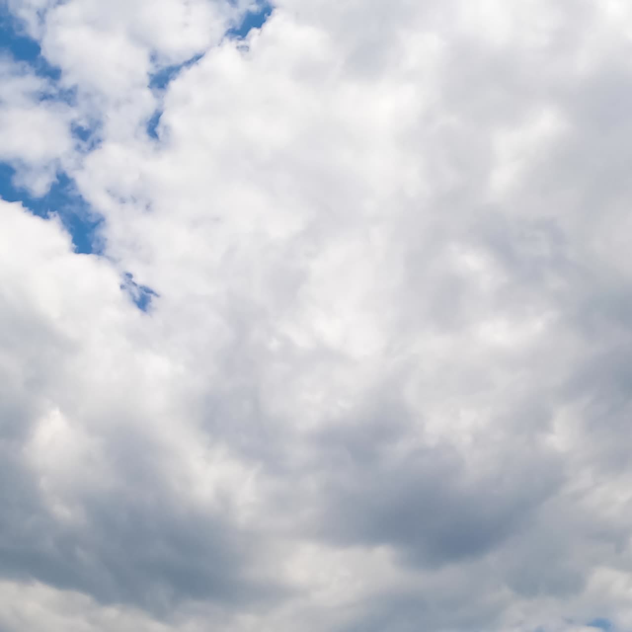 Accumulation of grey cloudscape in the atmosphere. Rainy clouds from low angle view. Low angle view. Timelapse