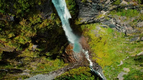 new zealand drone aerial of devil’s punchbowl waterfall, with downward spiral
