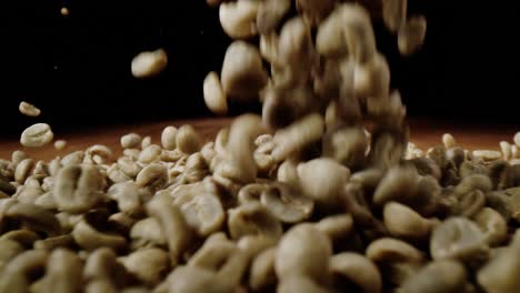 coffee beans fall onto a table