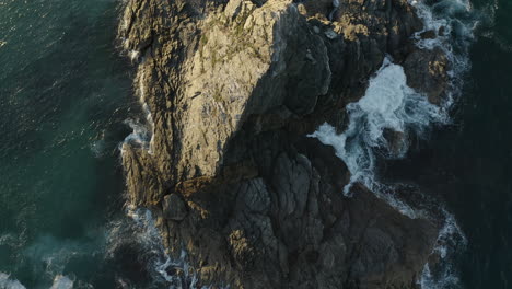 4k top view drone shot of a lonely island outside byron bay, australia