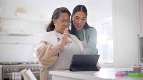 Tablet,-cooking-and-senior-mother-with-daughter