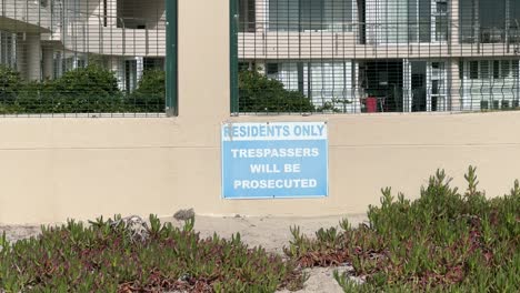 a trespassers will be prosecuted sign outside a hotel in milnerton, cape town.