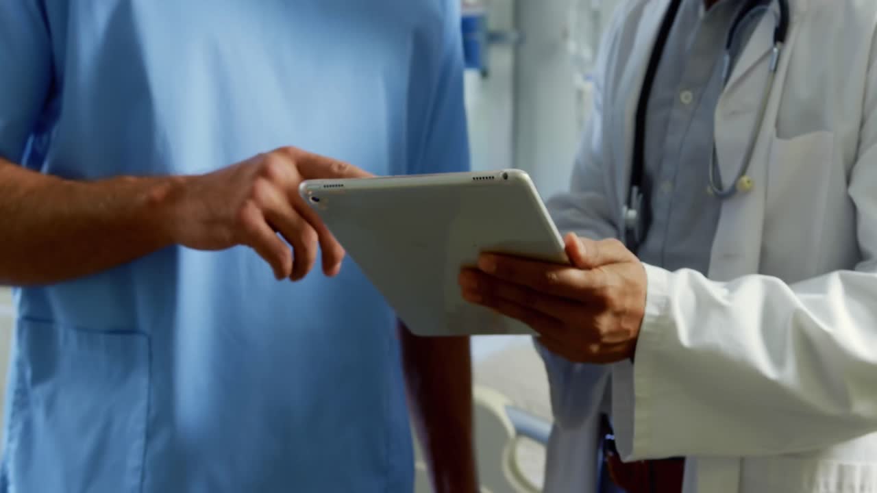 Animation of chemical equations over caucasian male doctors using tablet with patient in background