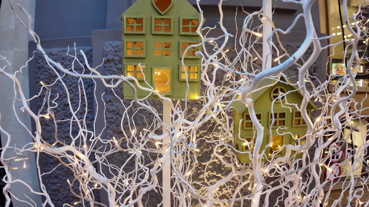 Small house with yellow lights as christmas decorations