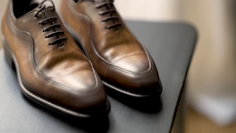 men brown leather shoes with umbra finish ready to wear, tilt up reveal shot