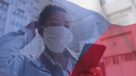 czech republic waving against woman wearing face mask using smartphone