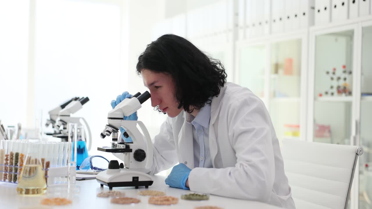 Scientist Using a Microscope in a Laboratory