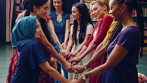 women holding hands in circle