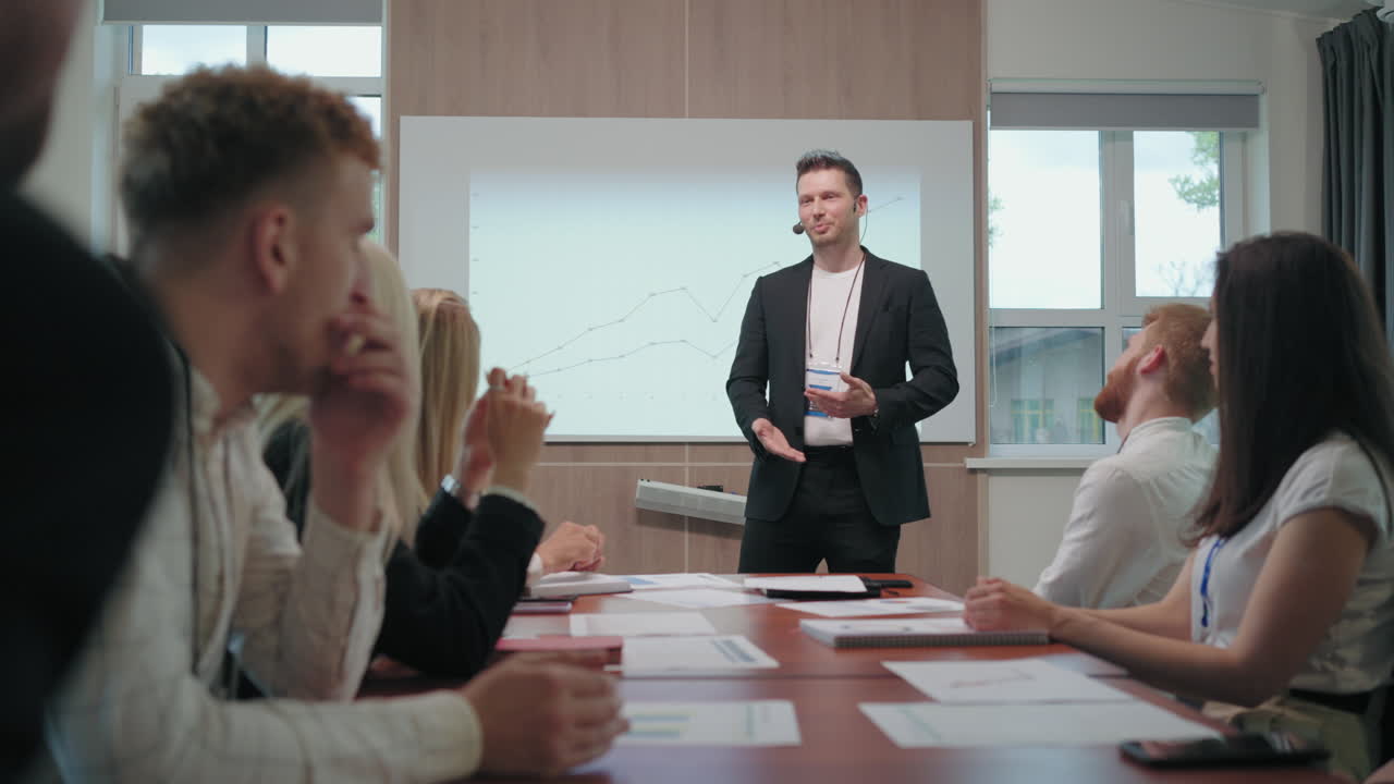 professional business coach and SEO specialist is speaking in meeting of specialists and managers